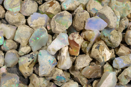 Raw opals uncut with flashes of rainbow color showing in the gem